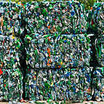 Aerial view of larges bales of crushed plastic bottles ready for recycling.