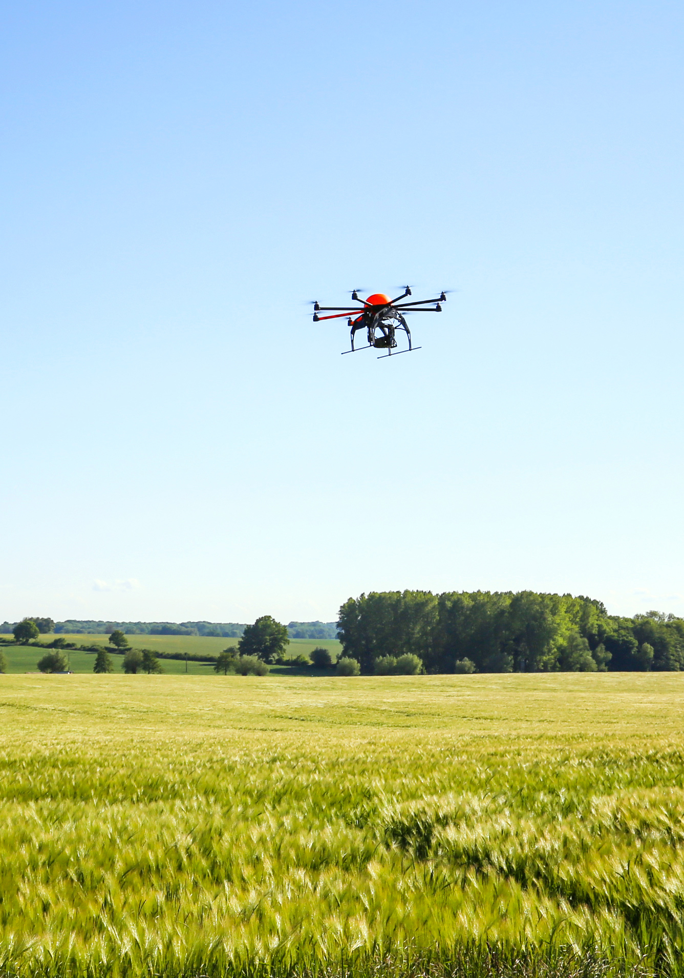 Drone flying in an open field